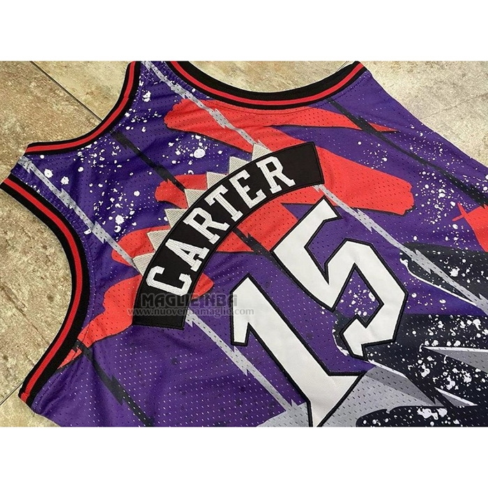 Maglia
 Vince Carter NO 15 Toronto Raptors Mitchell & Ness 1998-99 Viola
